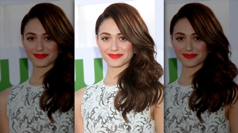 Emmy Rossum posing for a picture with her signature brunette color