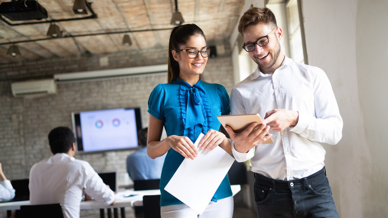 Man and woman talking at work 