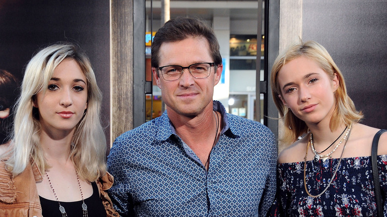 Eric Close posing with his daughters 