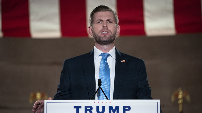 Eric Trump standing at a podium