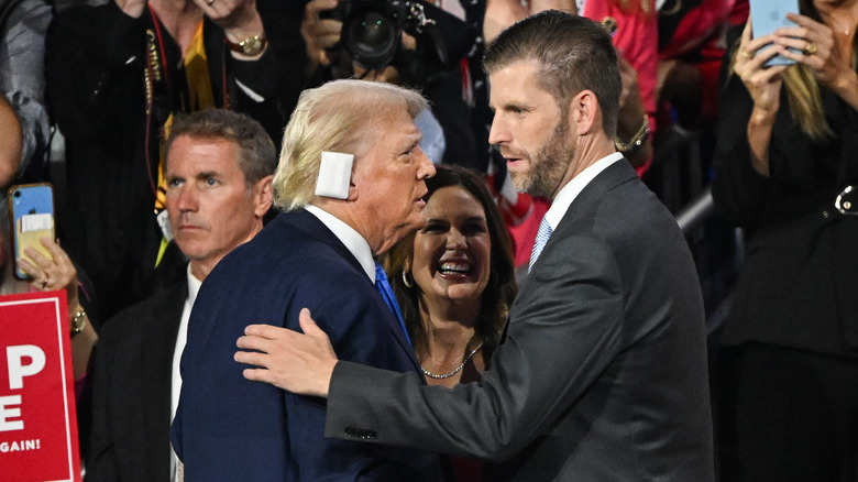 Donald Trump and Eric Trump hugging