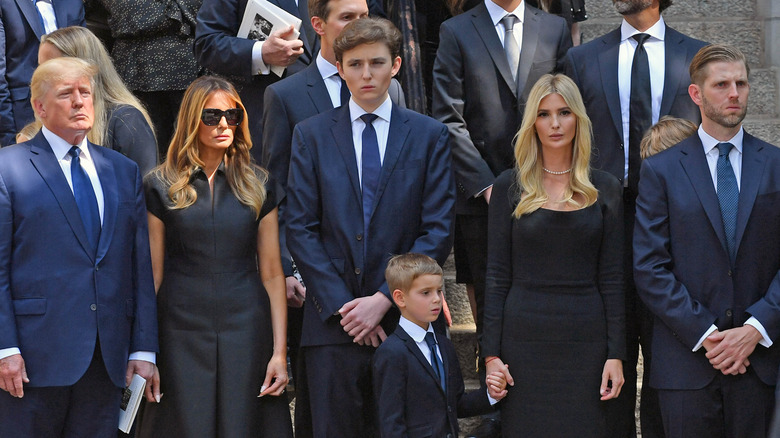 All of the Trumps posing grumpily together