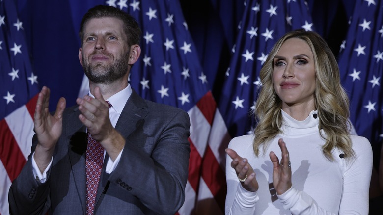 Eric Trump and Lara Trump clapping