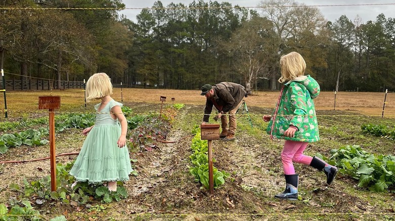 Ben Napier and his daughters in the garden