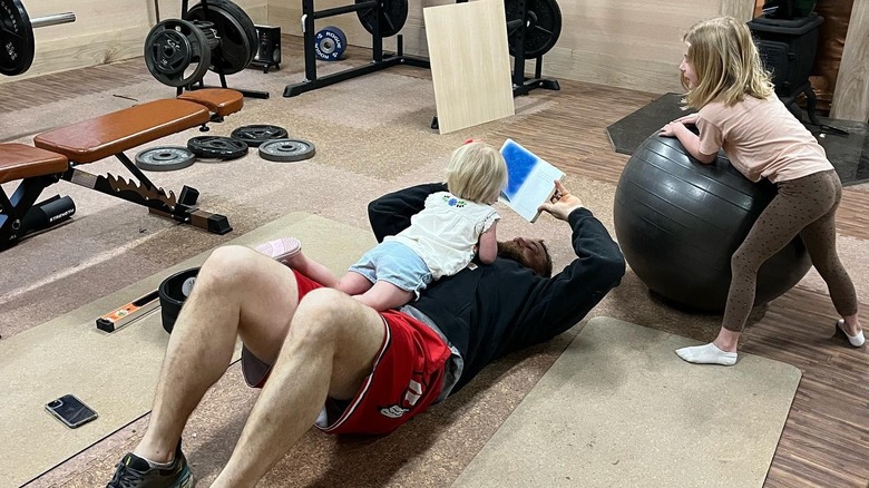 Ben working out with his kids