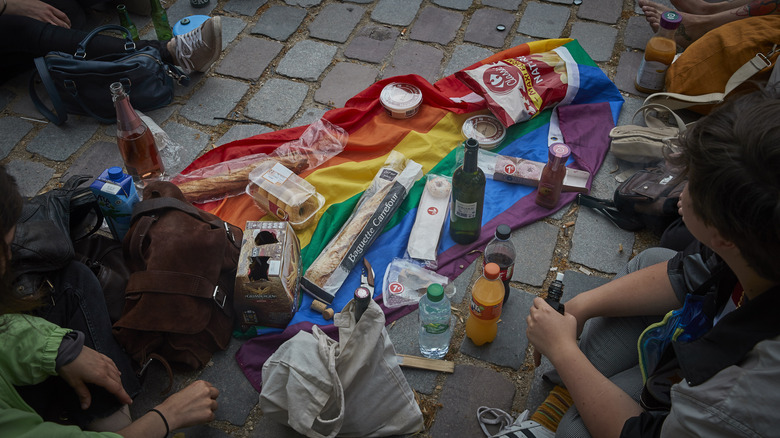 snacks and water on a pride flag