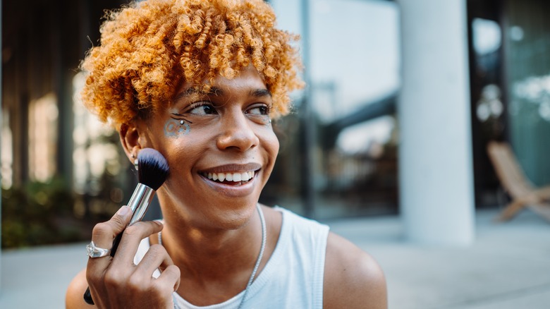 Person applying makeup