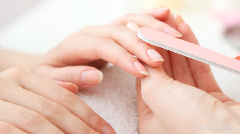 Healthy nails being filed