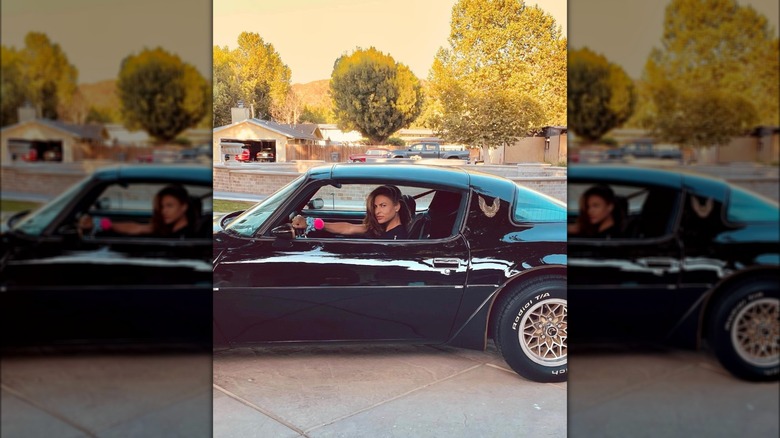 Eva Mendes driving a muscle car