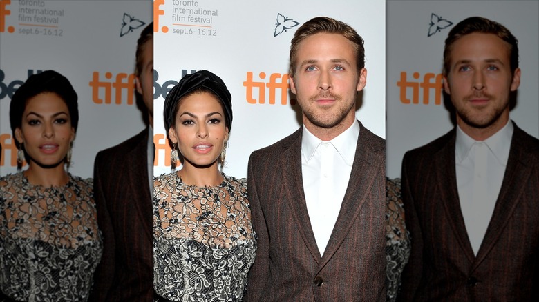 Eva Mendes and Ryan Gosling standing next to each other