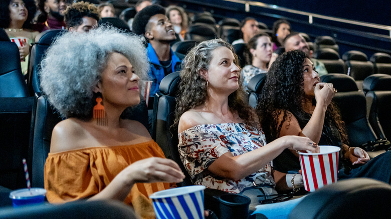 Women watching movie in theater