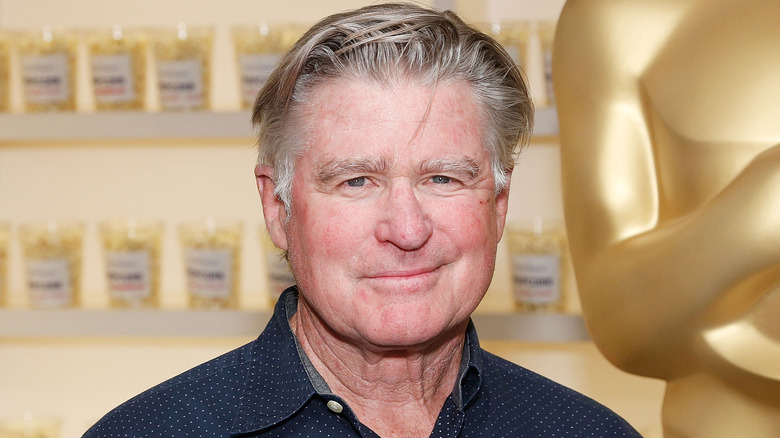 Treat Williams smirking