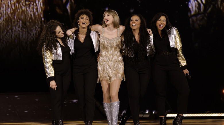 Taylor Swift on stage with backup dancers