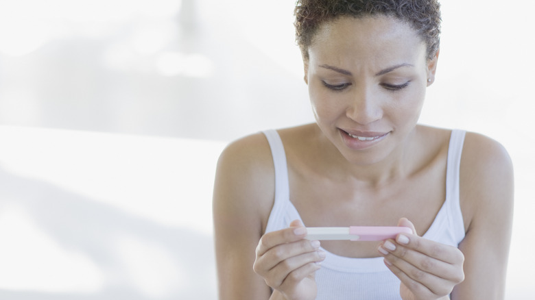 Woman doing pregnancy test