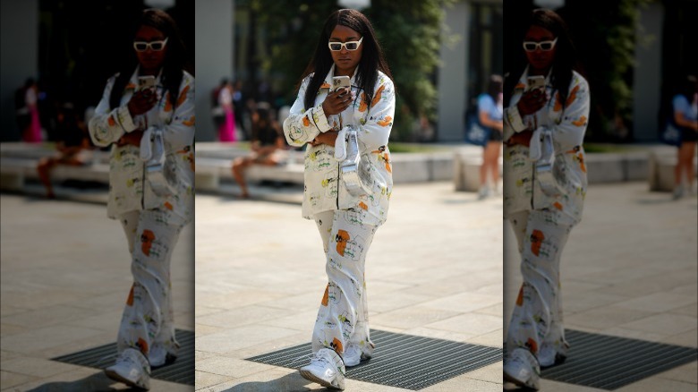 woman wearing white sneakers 