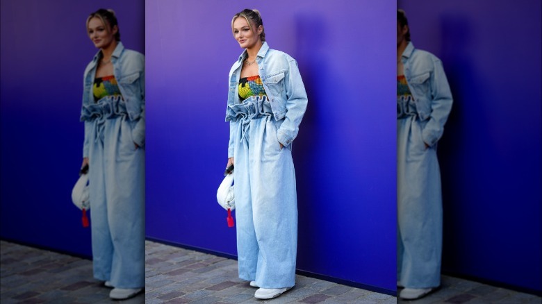 woman wearing white sneakers, all denim outfit