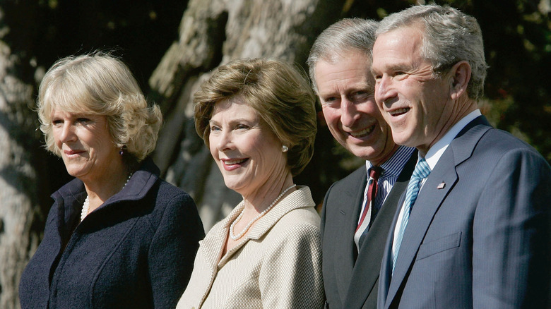 Camilla Parker Bowles, Laura Bush, King Charles, and George Bush smiling