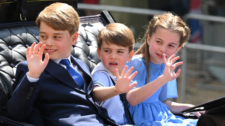 Prince George, Princess Charlotte, and Prince Louis waving