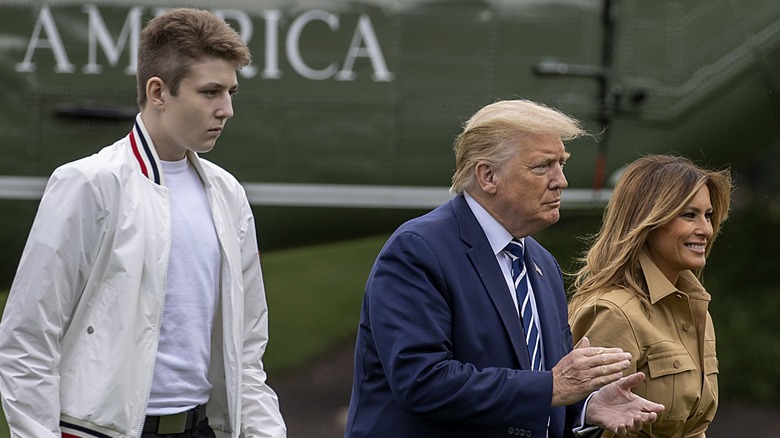 Barron Trump, Donald Trump, and Melania Trump