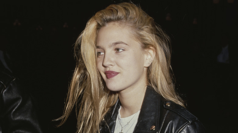 Young Drew Barrymore at an event. 