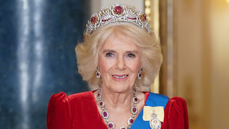 Queen Camilla wearing a tiara and smiling