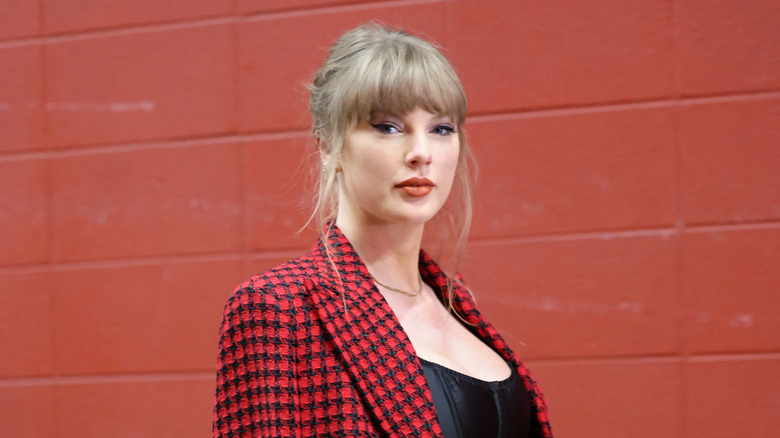 Taylor Swift arriving to a Kansas City Chiefs game in red