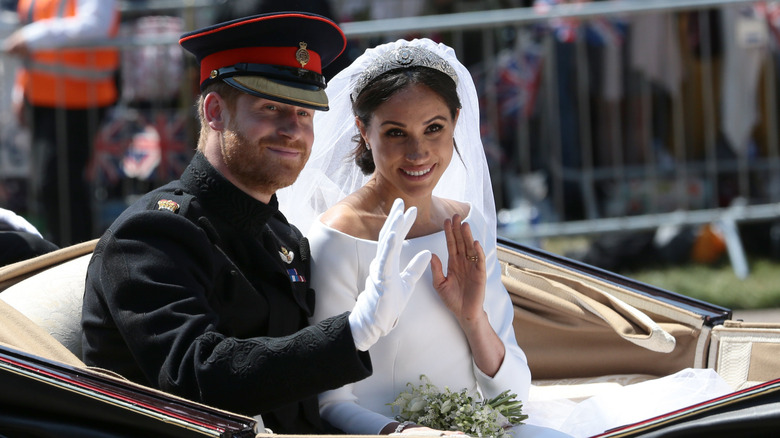 Prince Harry and Meghan Markle waving