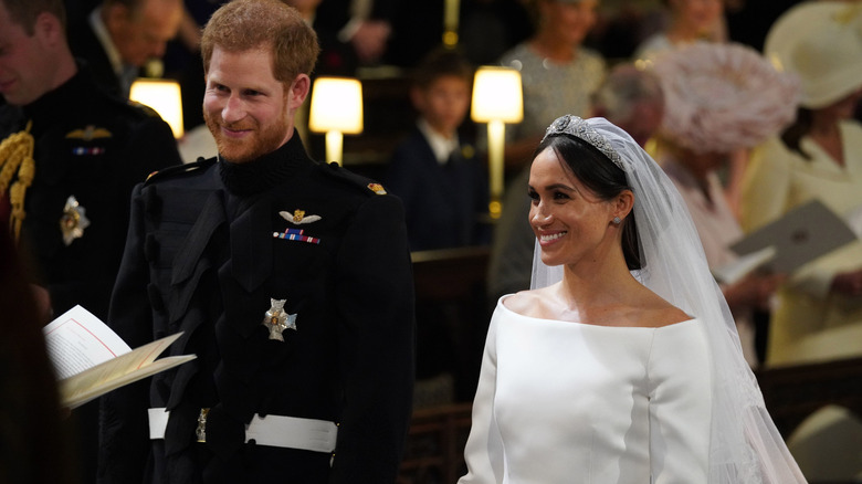 Prince Harry and Meghan Markle smiling