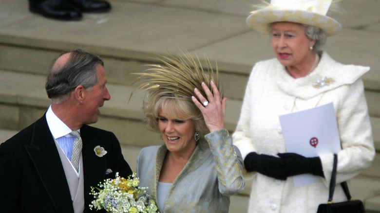 Charles talking to Queen Elizabeth with Camilla