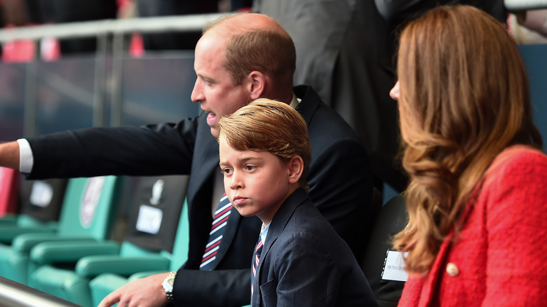 Prince George with his parents 