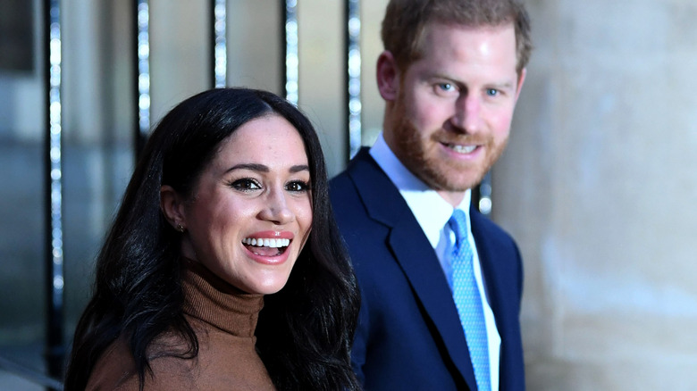 Harry and Meghan smiling in Canada 