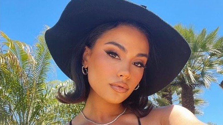 Jade Ramey wearing a big floppy black hat 