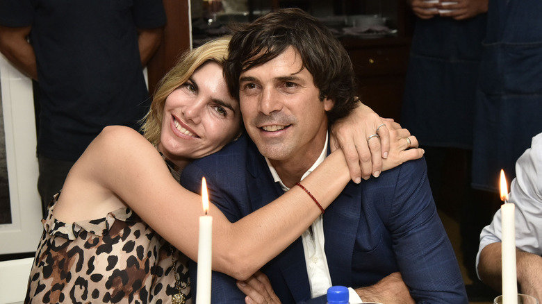 Delfina Blaquier and Nacho Figueras smiling and embracing