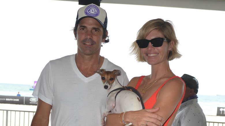 Delfina Blaquier and Nacho Figueras smiling with their dog