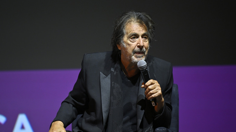 Al Pacino speaking into a microphone