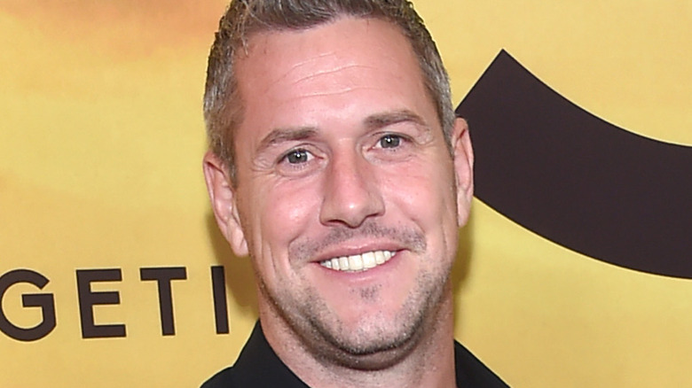 Ant Anstead smiles with a black shirt.