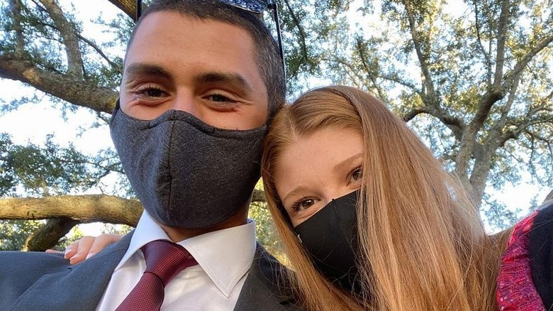 Nayel Nassar and Jennifer Gates wearing masks while out in nature
