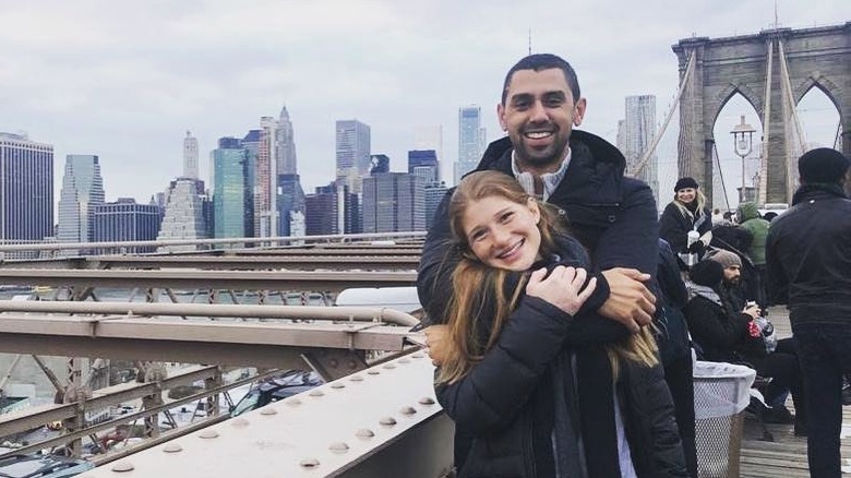 Jennifer Gates and Nayel Nassar posing for a sweet photo on a bridge