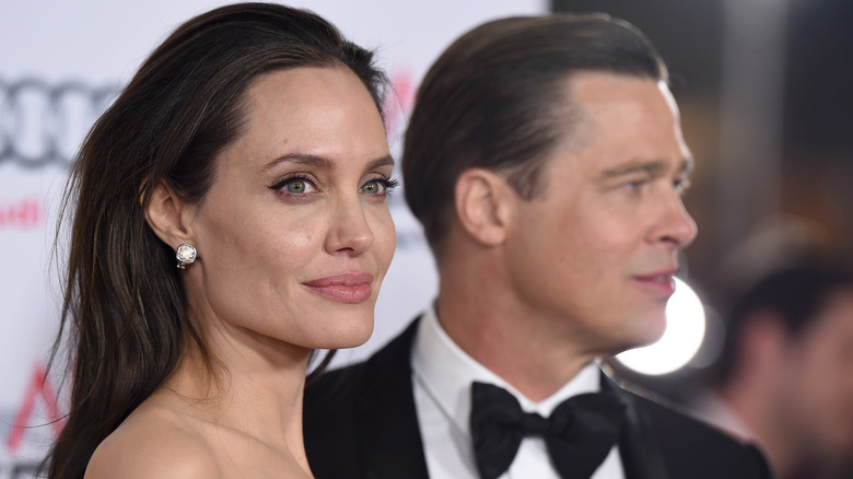 Brad Pitt and Angelina Jolie posing for photos