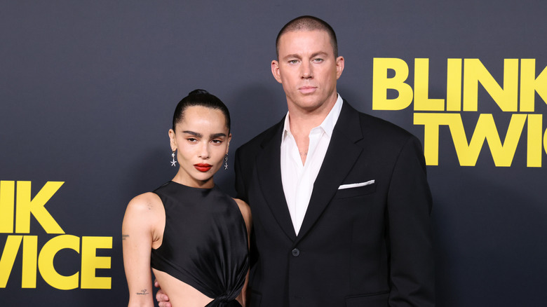 Channing Tatum and Zoe Kravitz looking stern in matching black outfits