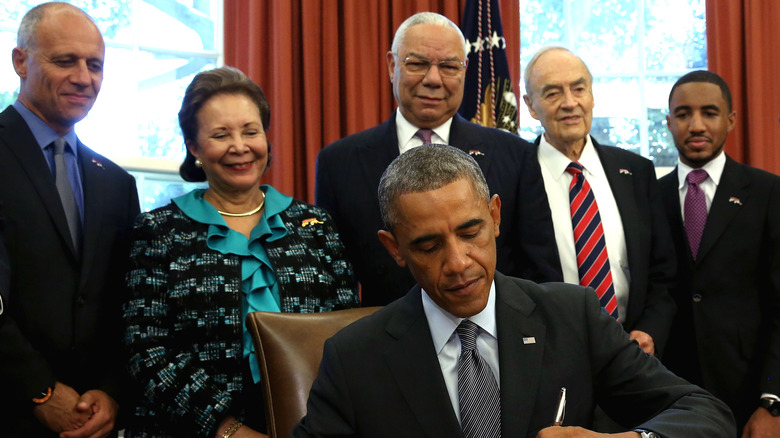 Alma and Colin Powell with Barack Obama in the White House