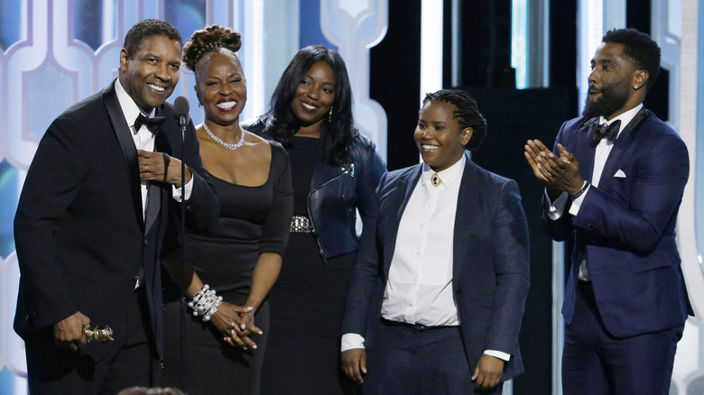 Denzel and Pauletta Washington with three of their four children