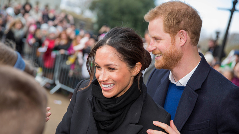 Meghan Markle and Prince Harry with crowds 