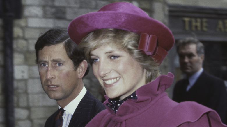 Diana Spencer and Prince Charles walking outside