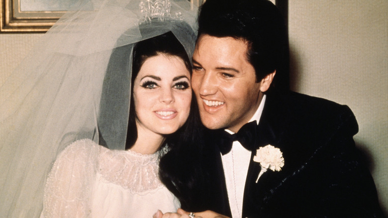 Priscilla Presley and Elvis Presley on their wedding day