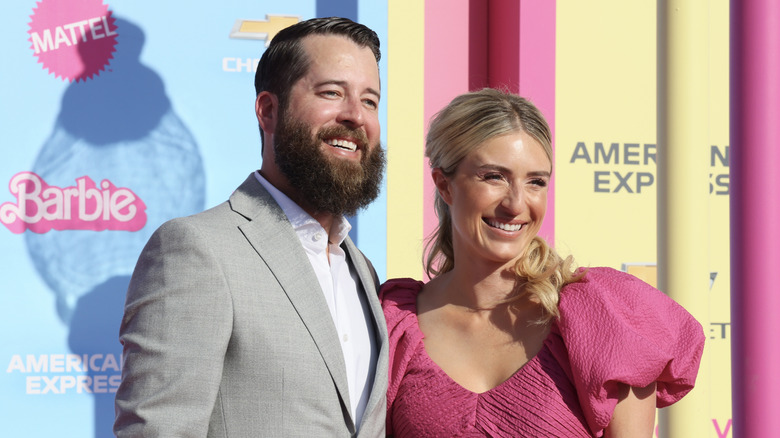 Jasmine Roth and husband pose at the Barbie movie premiere