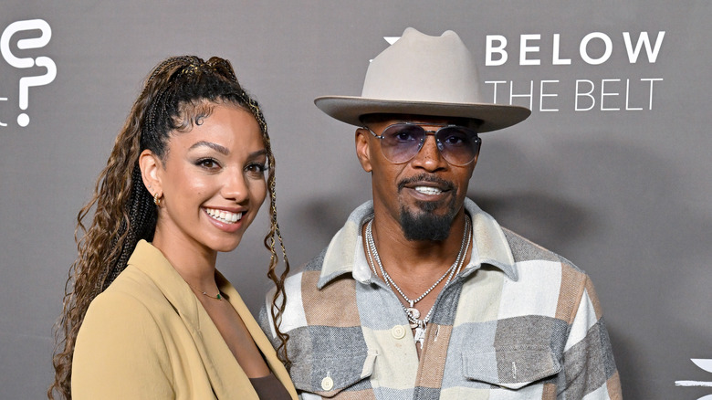 corrine and jamie foxx pose on the red carpet