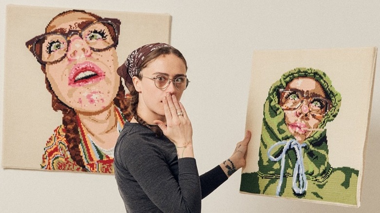 Ella Emhoff looking surprised with her knit portraits