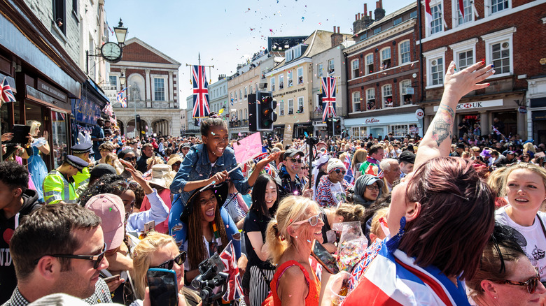 Crowds in Britain celebrating waving flags