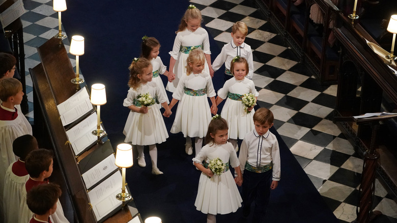 Royal children walking down church aisle